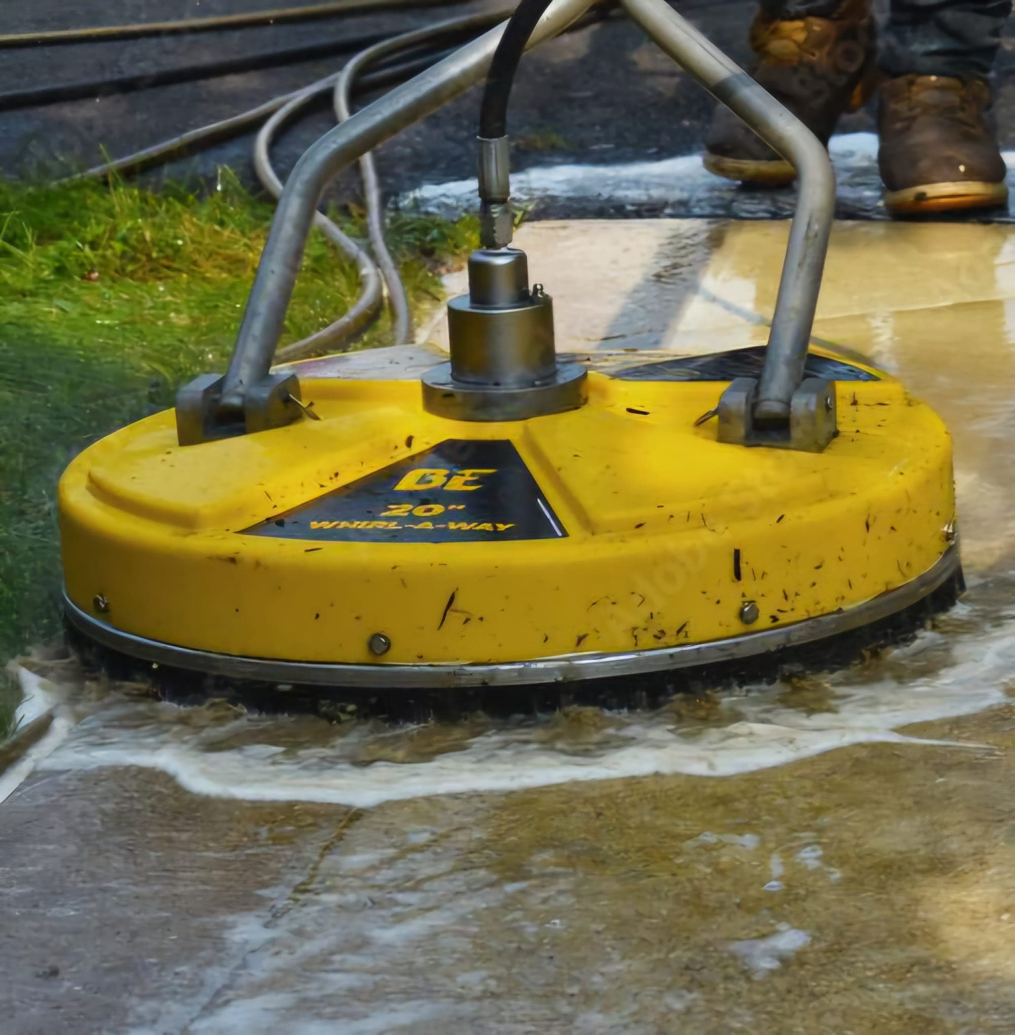 Pressure washing in Barnsley - rotary surface cleaner lifting dirt from paving slabs